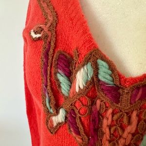 Stunning free people sweater with cutouts around the neckline